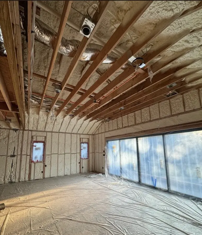 Interior walls and ceiling insulated with spray foam during new construction in Topsfield